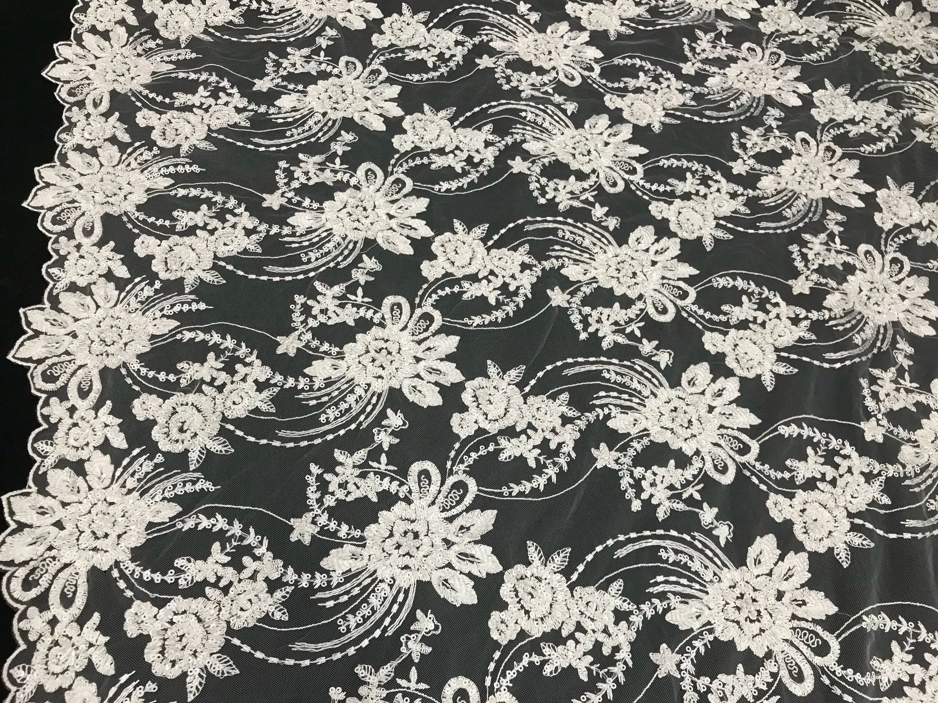 White hand beaded floral design embroider on a mesh lace-dresses-fashion-apparel-nightgown-prom-decorations-sold by the yard.