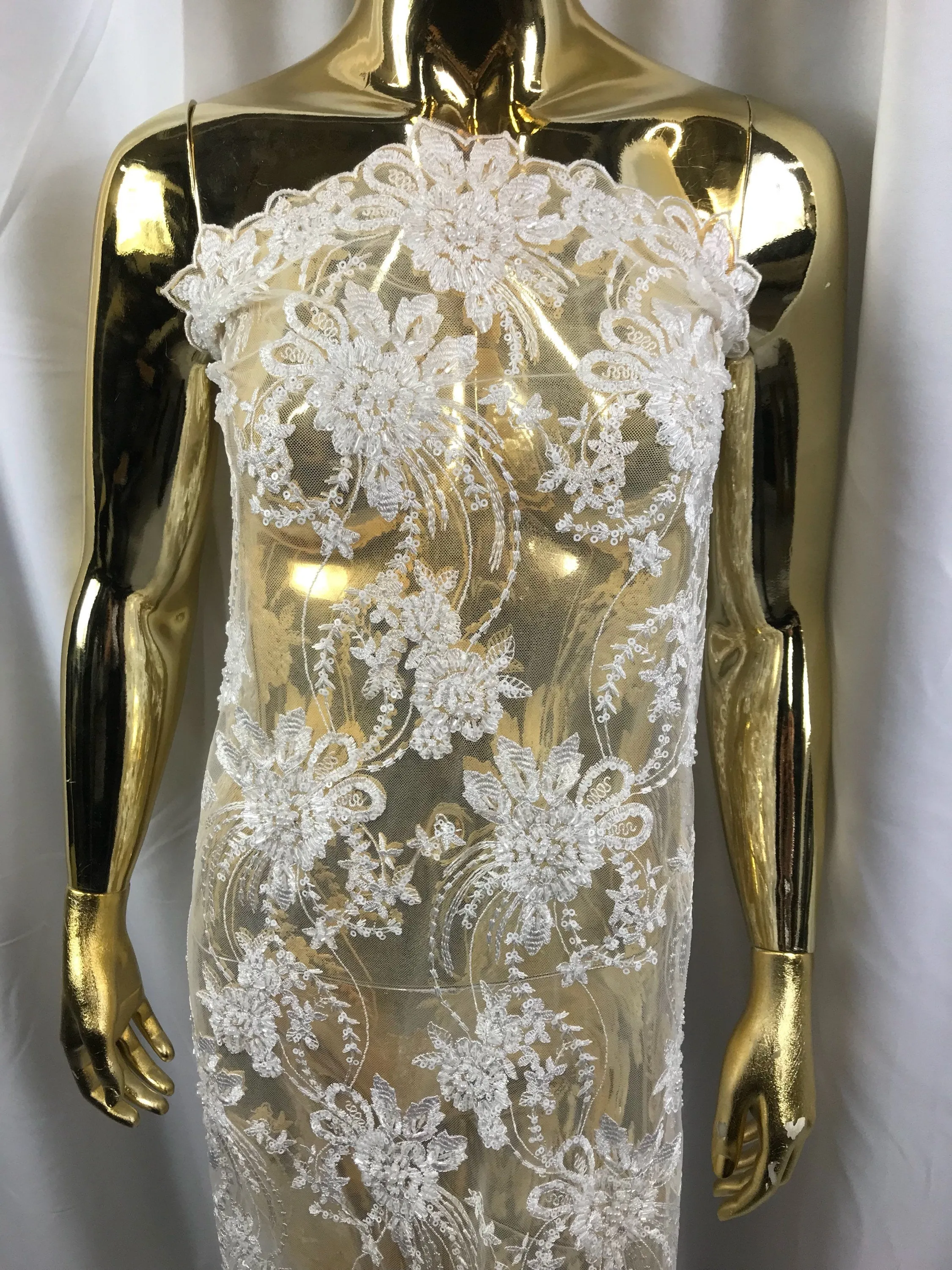 White hand beaded floral design embroider on a mesh lace-dresses-fashion-apparel-nightgown-prom-decorations-sold by the yard.