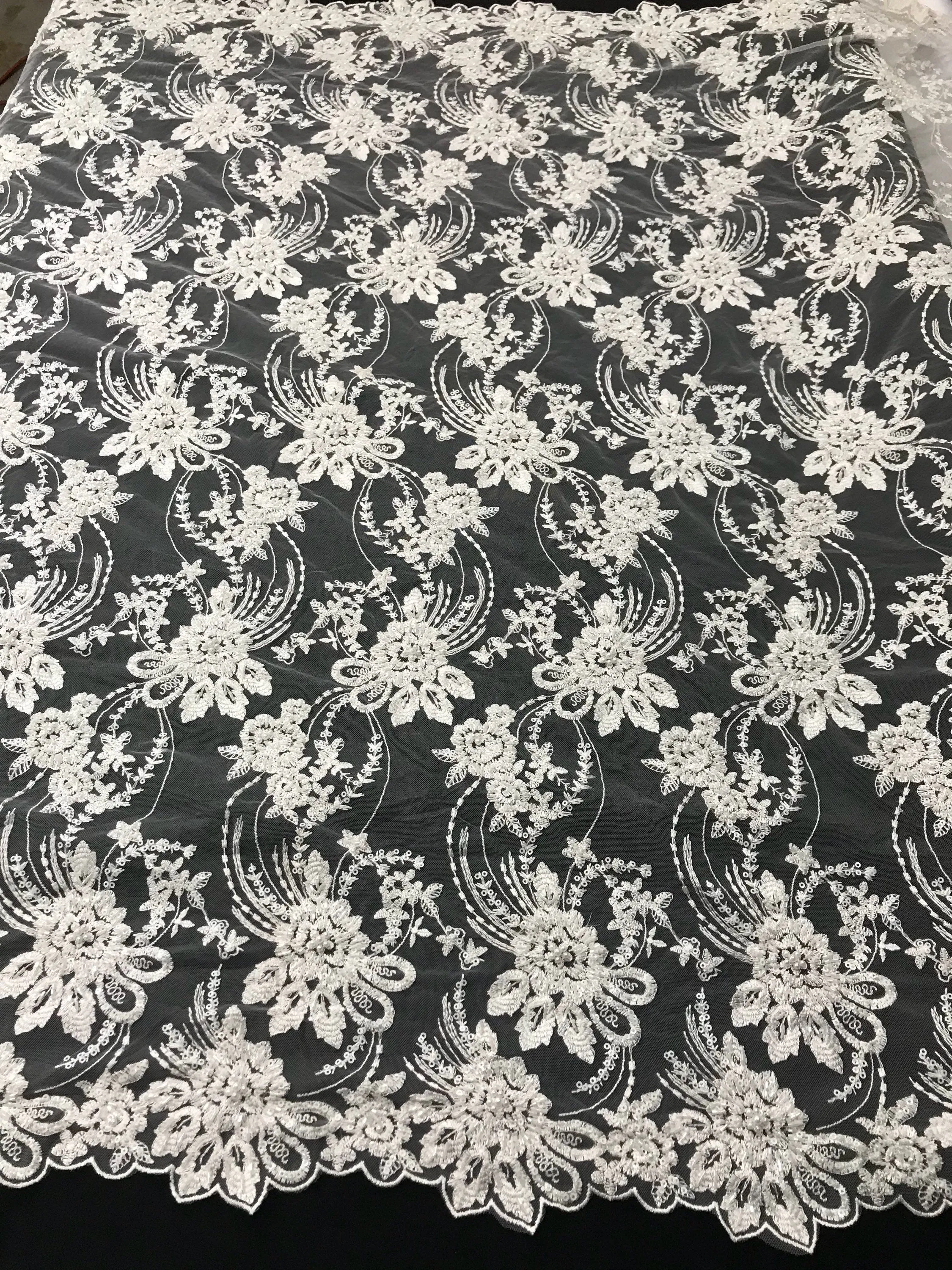 White hand beaded floral design embroider on a mesh lace-dresses-fashion-apparel-nightgown-prom-decorations-sold by the yard.